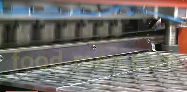 Metal cans lids making machines line Figure 4 -- Automatic sheet scrap discharge mechanism